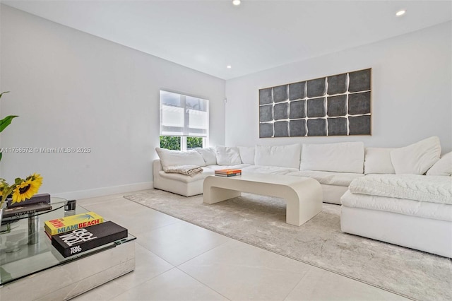 living area with recessed lighting and baseboards