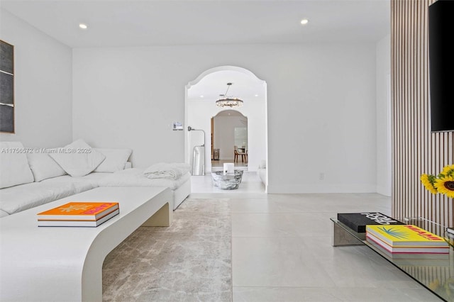 living room featuring arched walkways and recessed lighting