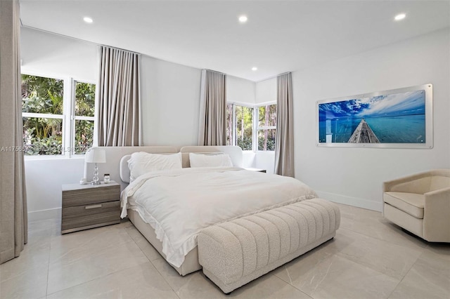 bedroom featuring recessed lighting and baseboards