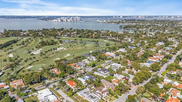 bird's eye view featuring a water view and view of golf course