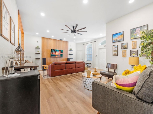 living room with recessed lighting, light wood-type flooring, and ceiling fan