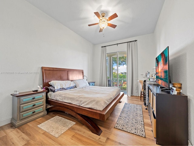 bedroom featuring vaulted ceiling, light wood-type flooring, a ceiling fan, and access to outside