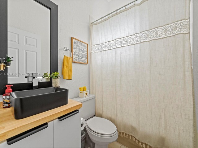 2430 SE 5th Ct, Homestead, FL 33033 - full bathroom featuring vanity, shower / tub combo, and tile patterned flooring