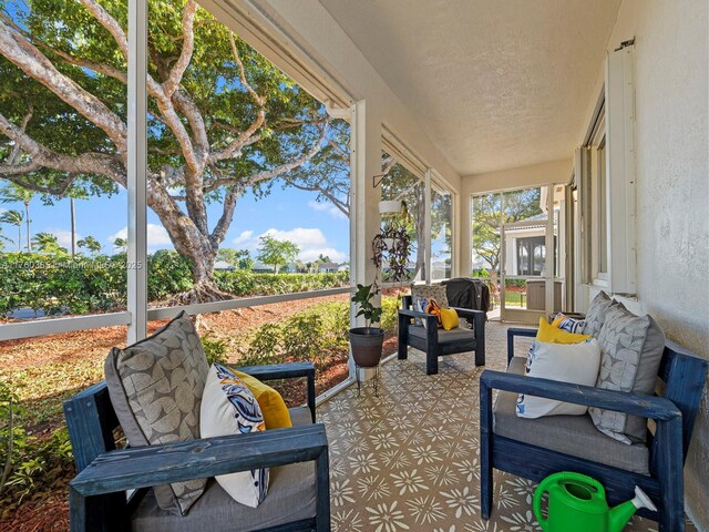 2430 SE 5th Ct, Homestead, FL 33033 - sunroom with an outdoor hangout area