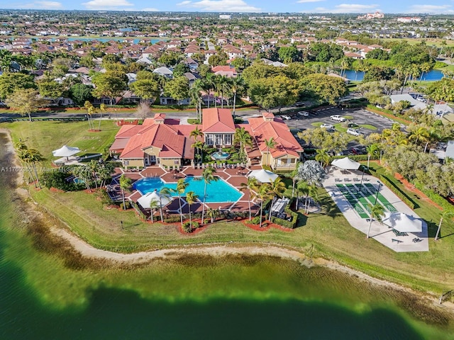 drone / aerial view featuring a residential view and a water view