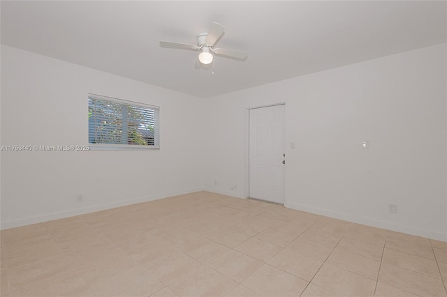 unfurnished room with light tile patterned floors, baseboards, and ceiling fan