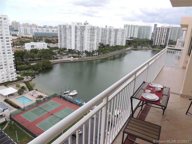 balcony with a city view and a water view