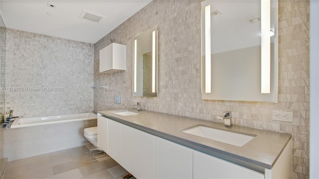 88 SW 7th St Unit 2208, Miami, FL 33130 - full bathroom with tile walls, a garden tub, double vanity, and decorative backsplash