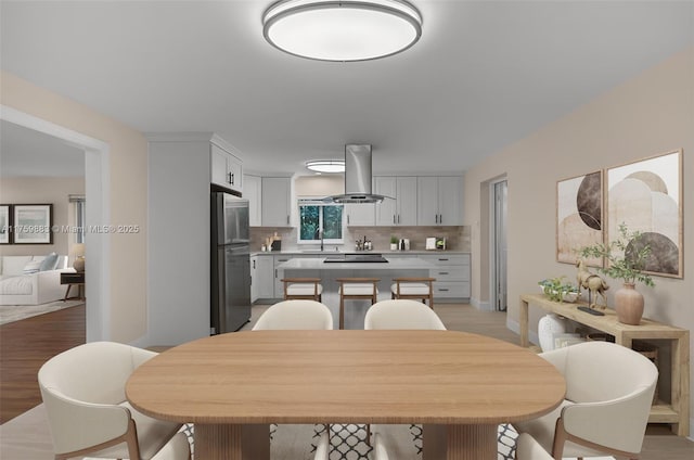 9720 Biscayne Blvd, Miami Shores, FL 33138 - dining space with light wood finished floors and baseboards