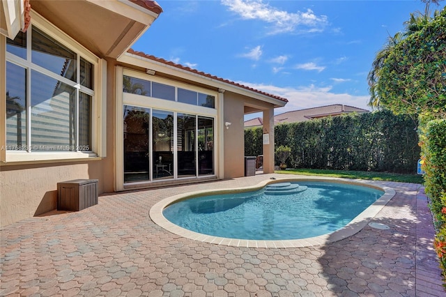 view of swimming pool featuring a patio area and a fenced in pool