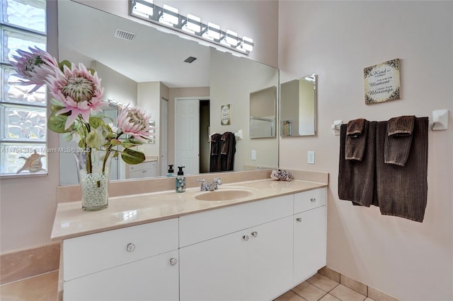 bathroom with tile patterned flooring, vanity, and visible vents