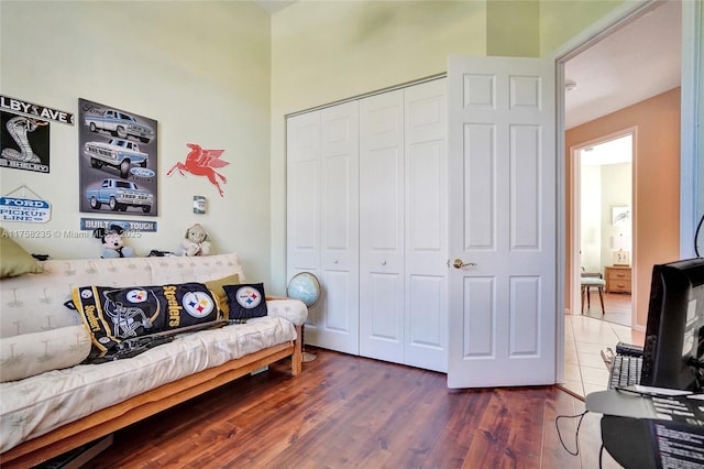 bedroom featuring a closet and wood finished floors