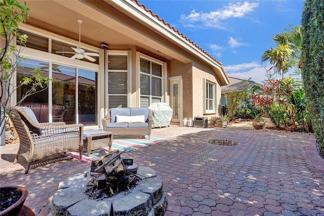 view of patio featuring area for grilling, an outdoor hangout area, and ceiling fan