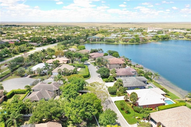 bird's eye view featuring a residential view and a water view