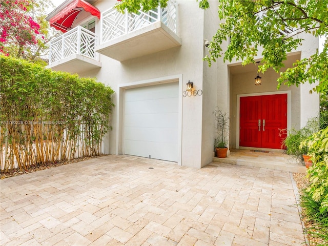 garage featuring decorative driveway