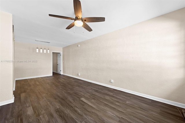 unfurnished room featuring ceiling fan, baseboards, and dark wood-style floors