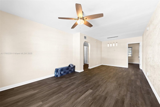 1311 N 19th Ave, Hollywood, FL 33020 - spare room featuring arched walkways, ceiling fan, wood finished floors, and baseboards