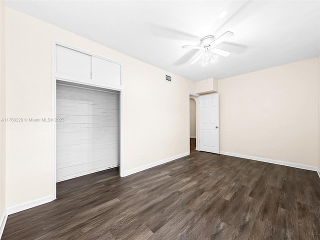 1311 N 19th Ave, Hollywood, FL 33020 - unfurnished bedroom with dark wood finished floors, baseboards, a closet, and a ceiling fan