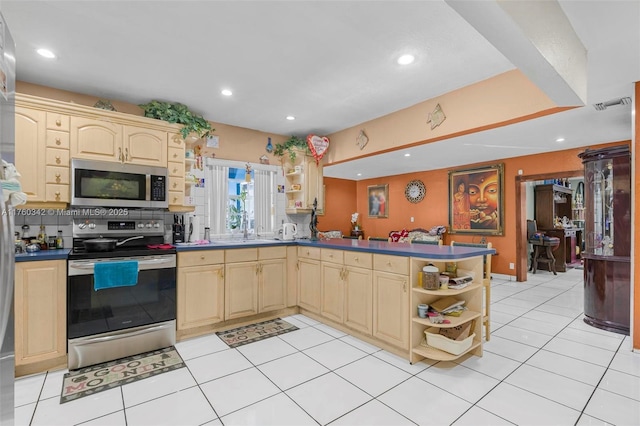 kitchen featuring visible vents, open shelves, dark countertops, stainless steel appliances, and a peninsula