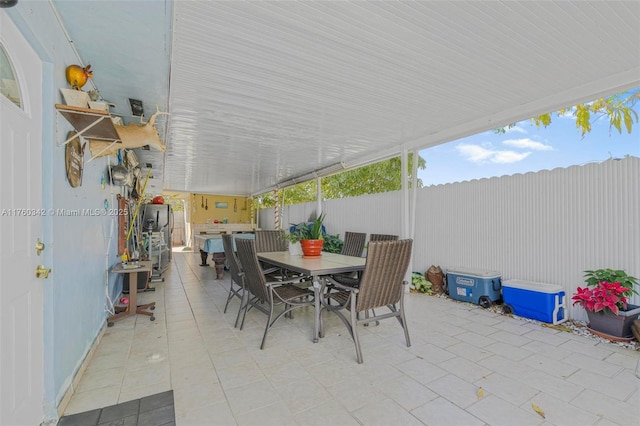 view of patio / terrace featuring outdoor dining area and fence