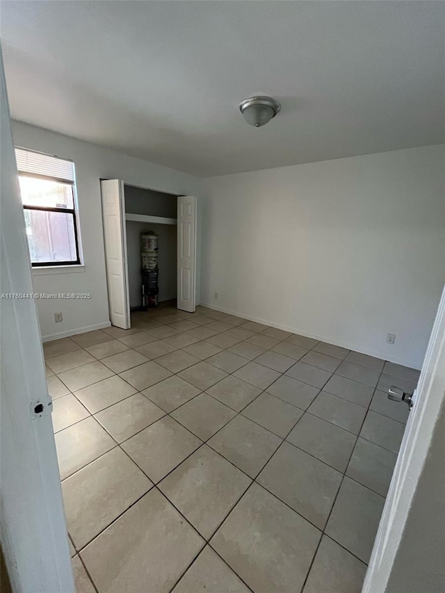 empty room with light tile patterned floors