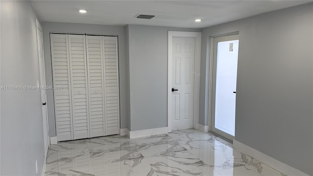 unfurnished bedroom featuring recessed lighting, visible vents, marble finish floor, and baseboards