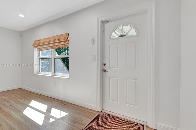 foyer entrance featuring recessed lighting, light wood-type flooring, and baseboards