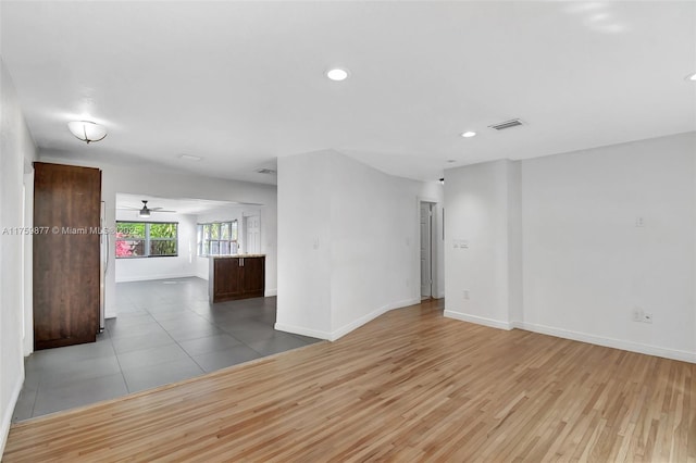 unfurnished room featuring recessed lighting, visible vents, baseboards, and wood finished floors