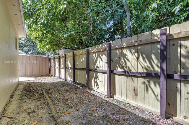 exterior space with a fenced backyard