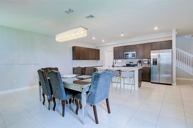 dining area featuring recessed lighting, visible vents, baseboards, and light tile patterned flooring