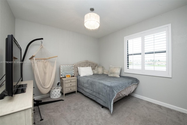 bedroom featuring carpet flooring and baseboards