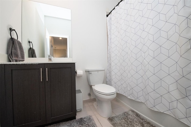 bathroom with tile patterned floors, toilet, shower / tub combo with curtain, and vanity