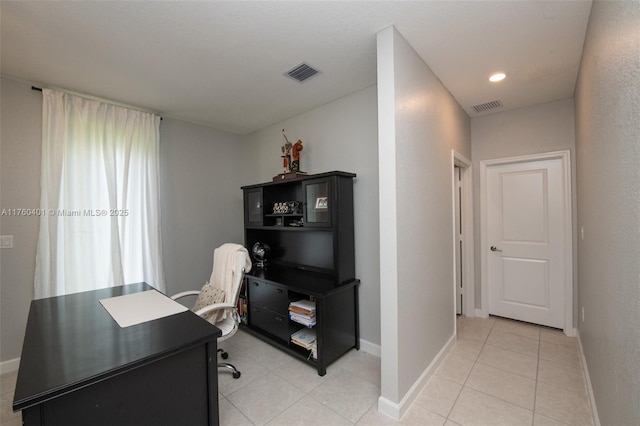 office with light tile patterned floors, baseboards, and visible vents