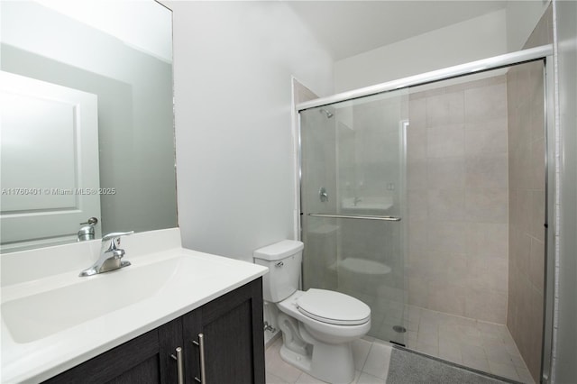 full bath with tile patterned floors, a shower stall, toilet, and vanity