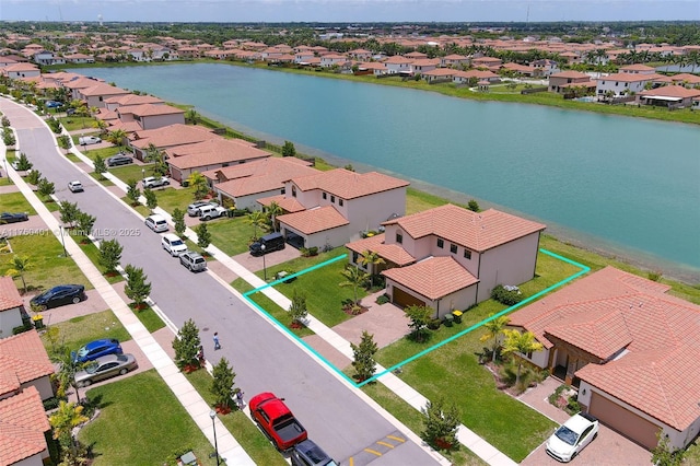 aerial view with a residential view and a water view