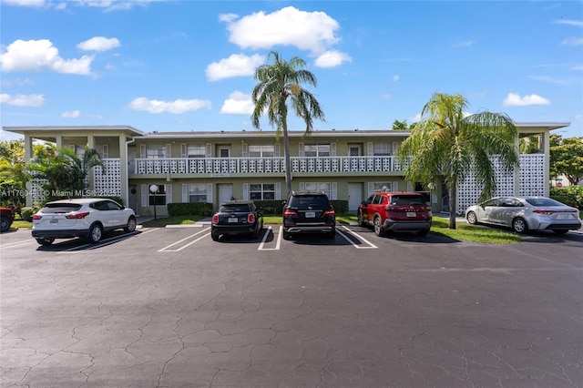 view of property featuring uncovered parking