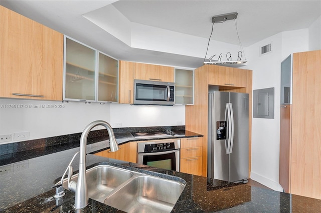 kitchen with visible vents, electric panel, a sink, stainless steel appliances, and modern cabinets