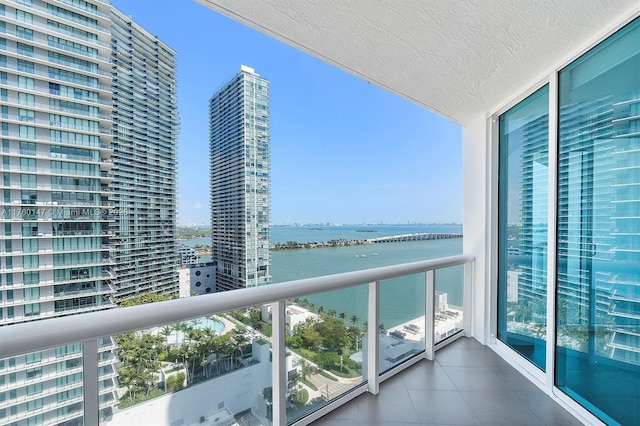 balcony with a view of city and a water view