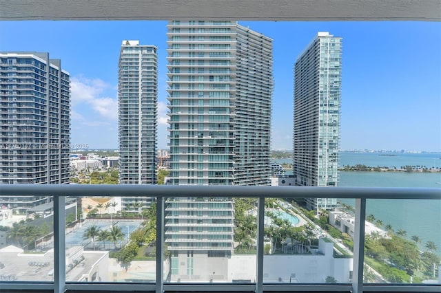 balcony with a city view and a water view