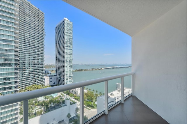 balcony with a city view and a water view