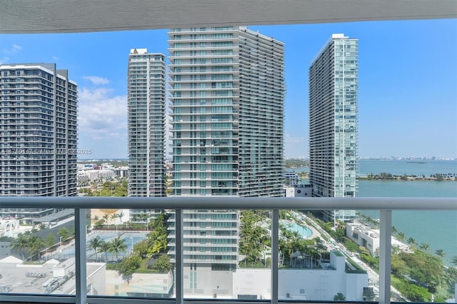 balcony featuring a view of city and a water view