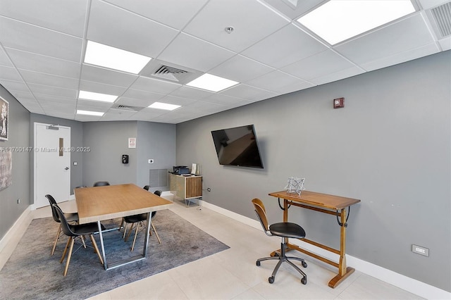 office featuring a paneled ceiling, visible vents, and baseboards