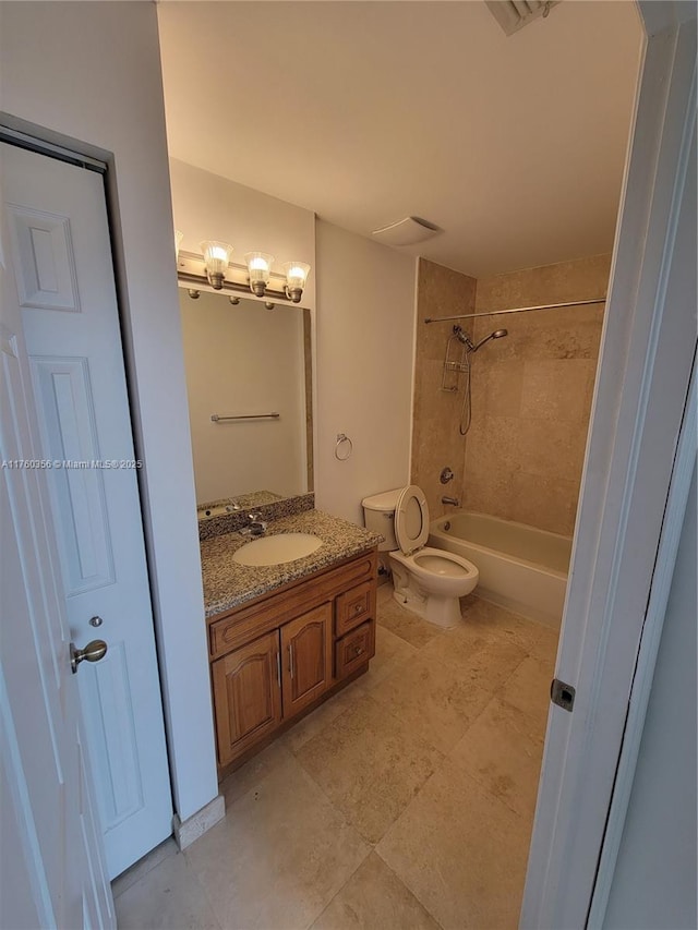 full bathroom with visible vents, toilet,  shower combination, and vanity