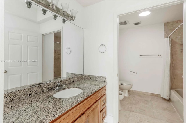 full bath featuring baseboards, vanity, a bidet, and visible vents