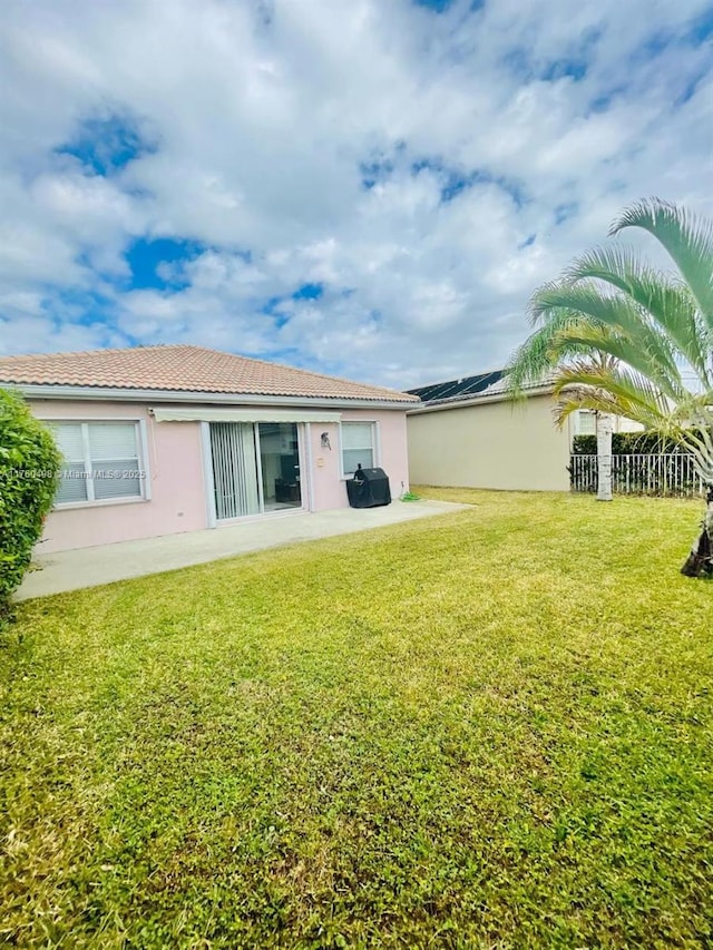 6938 NW 33rd St, Margate, FL 33063 - rear view of property with stucco siding and a tile roof