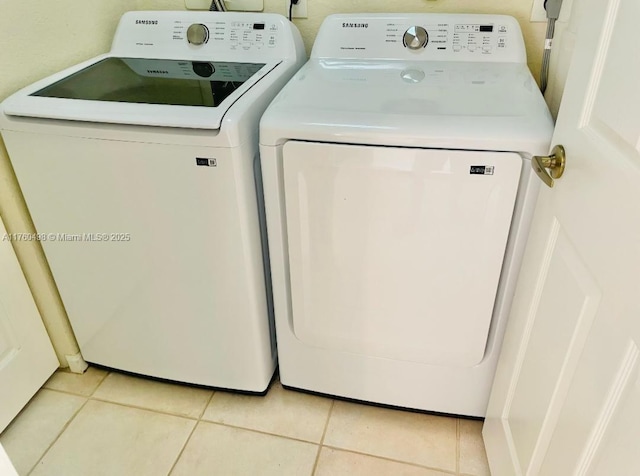 6938 NW 33rd St, Margate, FL 33063 - laundry area featuring washing machine and dryer and light tile patterned floors