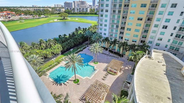 view of pool with view of golf course, a view of city, and a water view