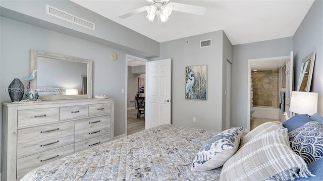 bedroom featuring visible vents, baseboards, a ceiling fan, and ensuite bathroom