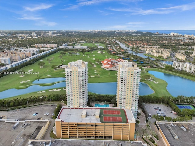 bird's eye view featuring view of golf course and a water view