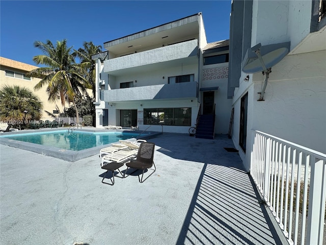 pool with a patio